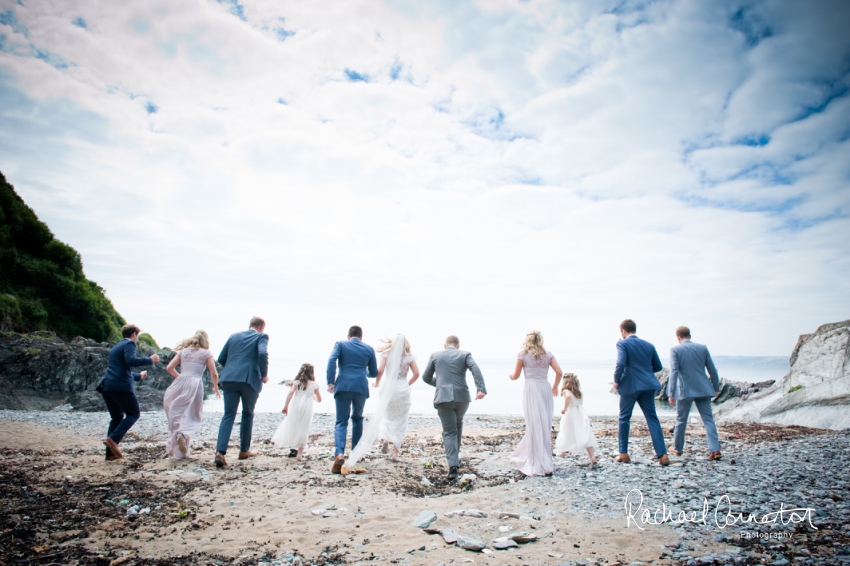 Professional colour photograph of Holly and Chris' Cornwall beach wedding at Palhawn Fort by Rachael Connerton Photography