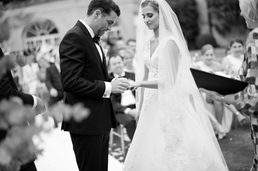 Professional black and white photograph of bride and groom during wedding ceremony at Stapleford Park