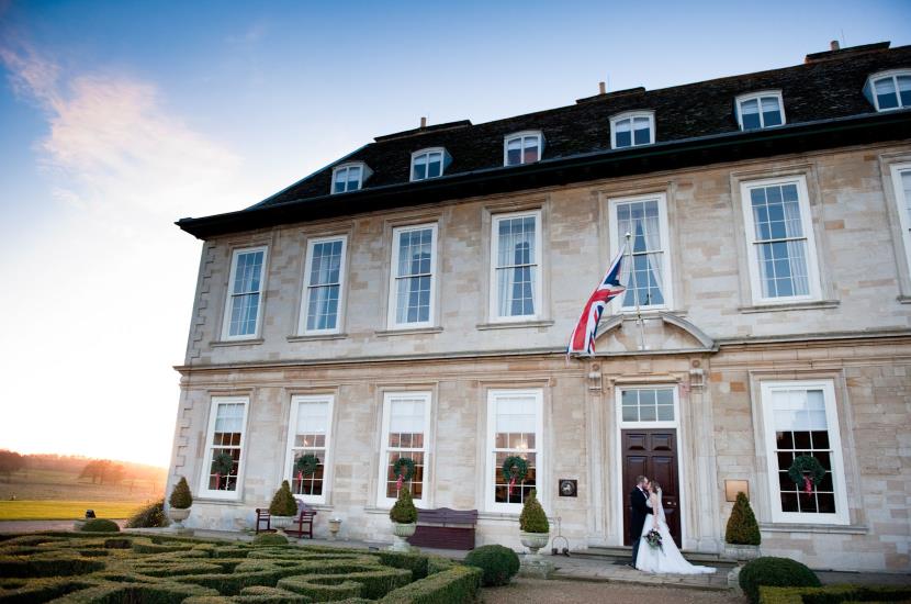 Professional colour photograph of Sarah and Johnathan's Christmas wedding at Stapleford Park